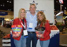 Showing two proprietary apple varieties (Karma and Juici) of Starr Ranch Growers are Krista Beckstead, Shawn Loudon and Ellie Tucker. 